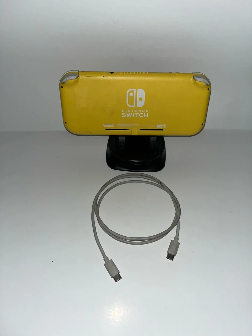 Yellow Nintendo switch light with charger